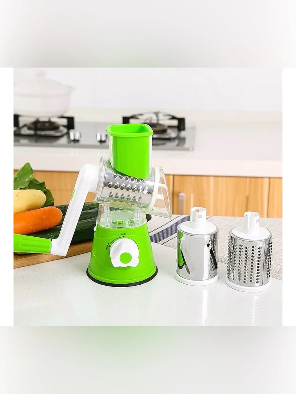 Tabletop Drummer Manual Green Vegetable Spiralizer and Grater with extra items.